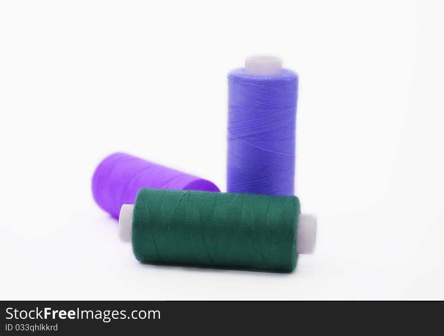 Three bobbins of threads