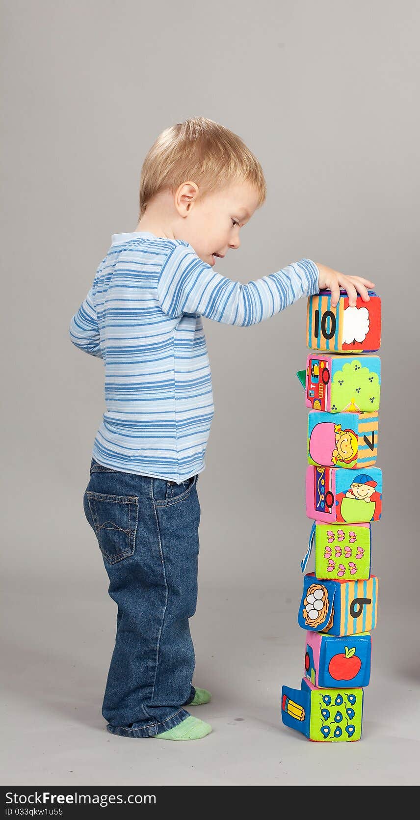 Baby boy playing with a colorful cube