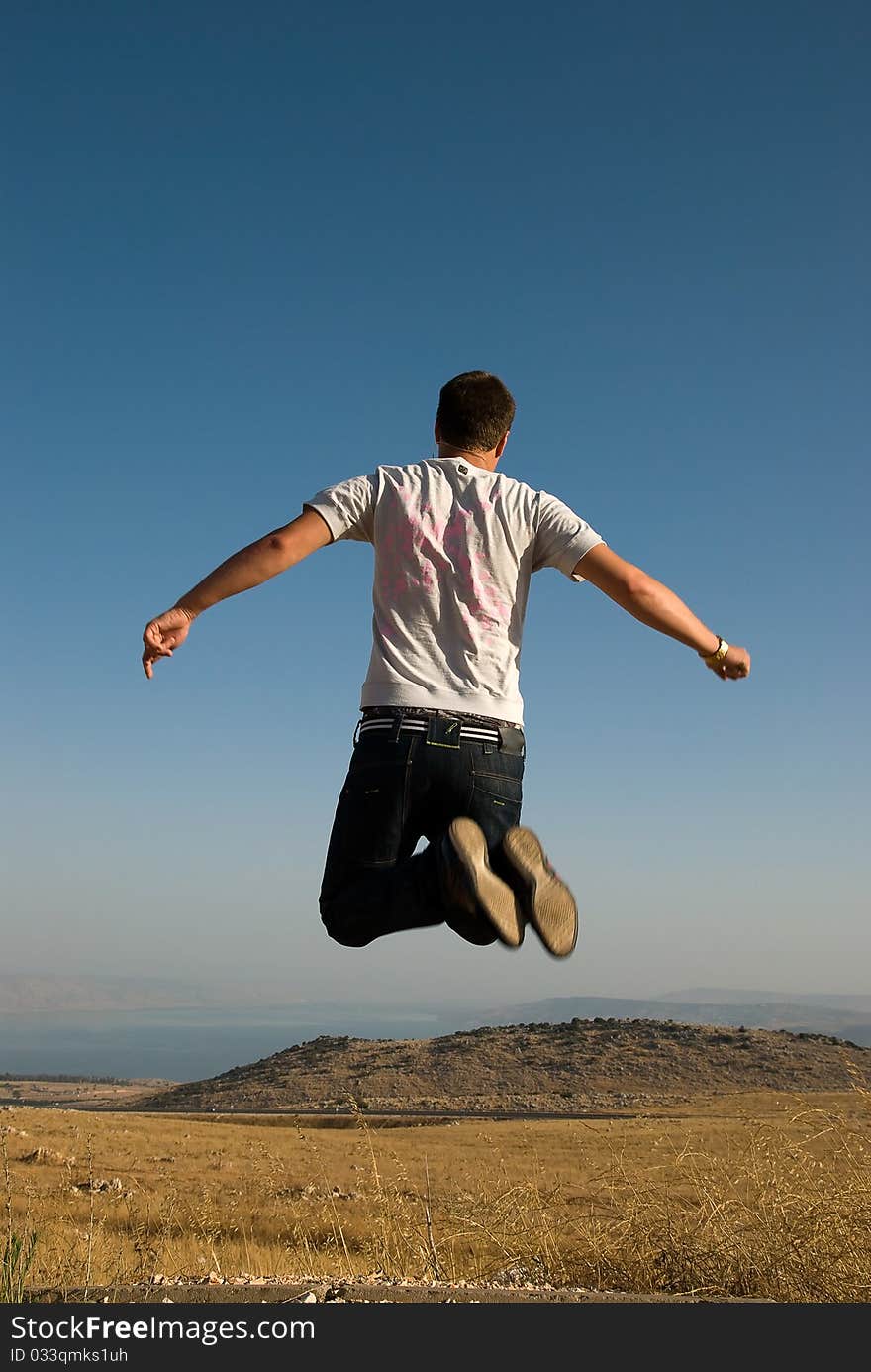 Young active man making a big jump. Young active man making a big jump