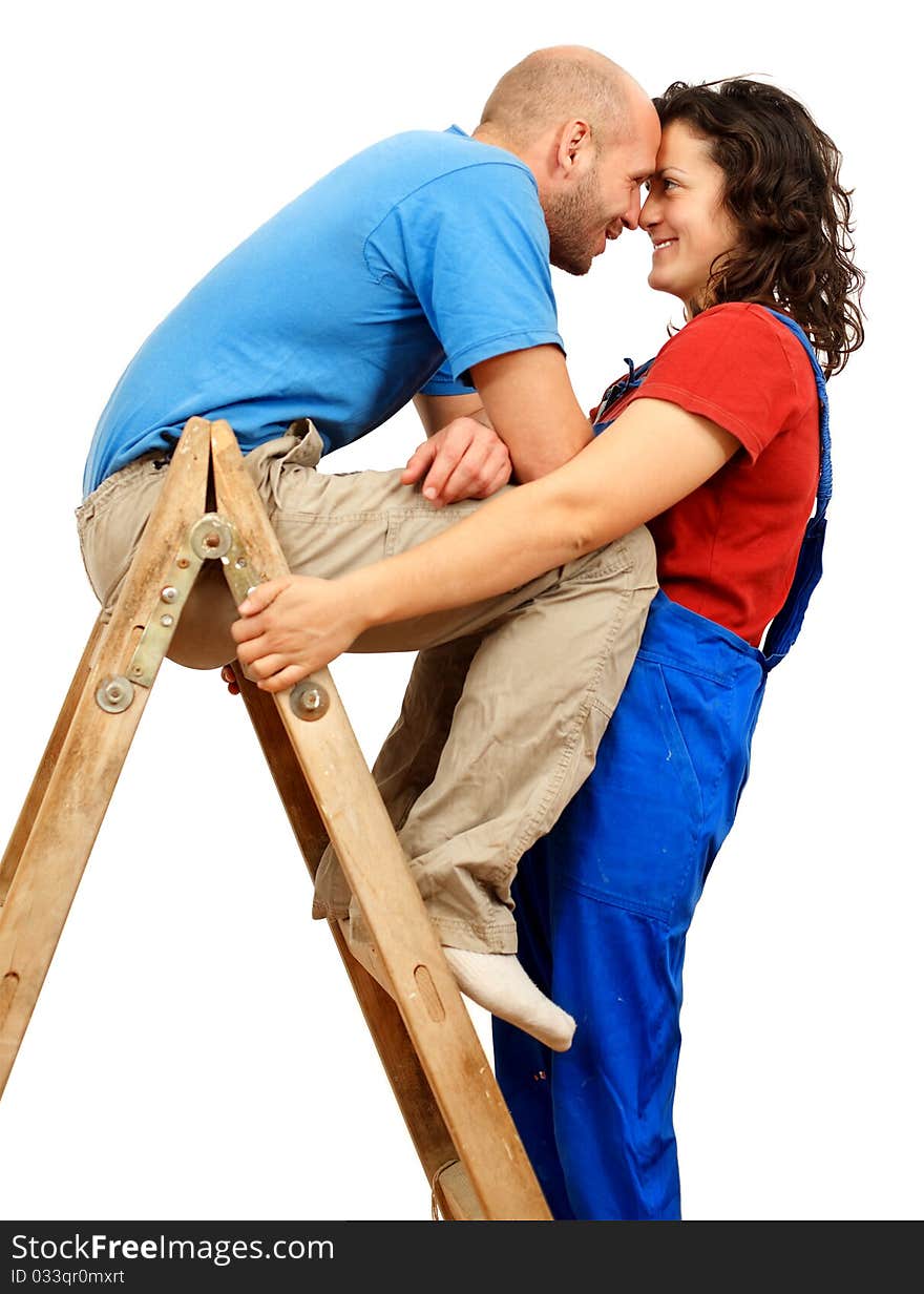 Worker man and woman at the ladder. Worker man and woman at the ladder