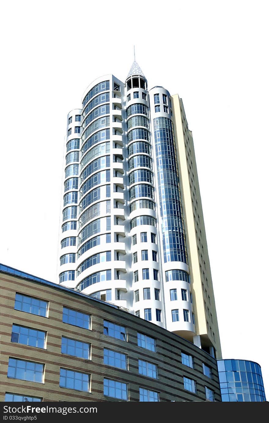 The modern habitant building of many storeys looks like high tower directed to sky. View from below. The modern habitant building of many storeys looks like high tower directed to sky. View from below.