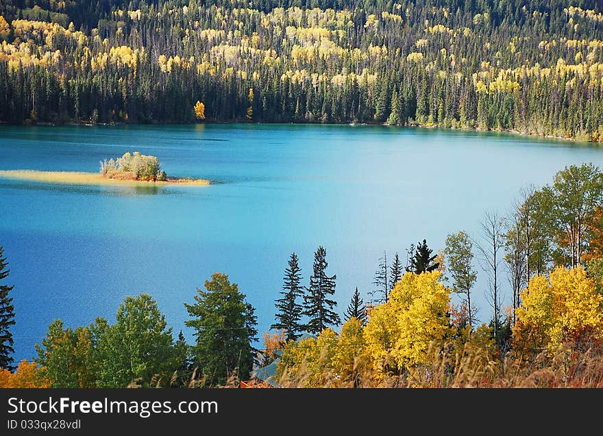 Lake surrounded by colorful forest in autumn. Lake surrounded by colorful forest in autumn