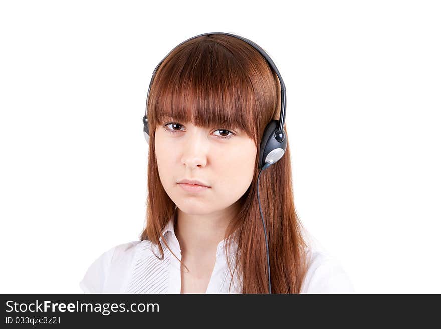 The beautiful girl listens to music in ear-phones. The beautiful girl listens to music in ear-phones