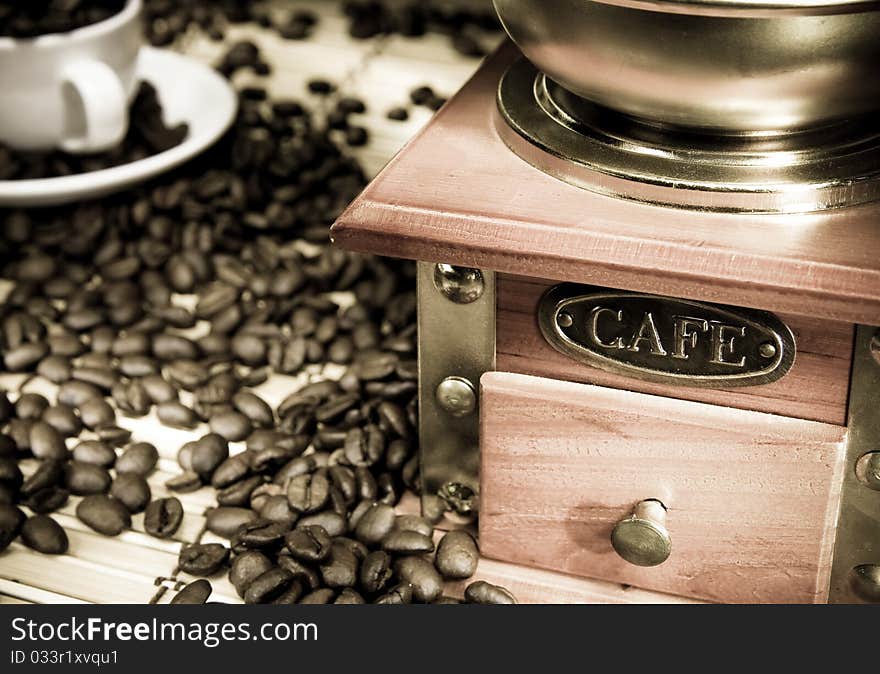 Coffee Beans, Cup And Grinder On Sack