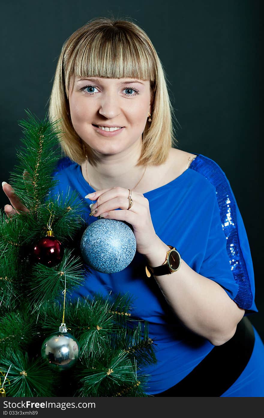 Girl in blue dress on black background