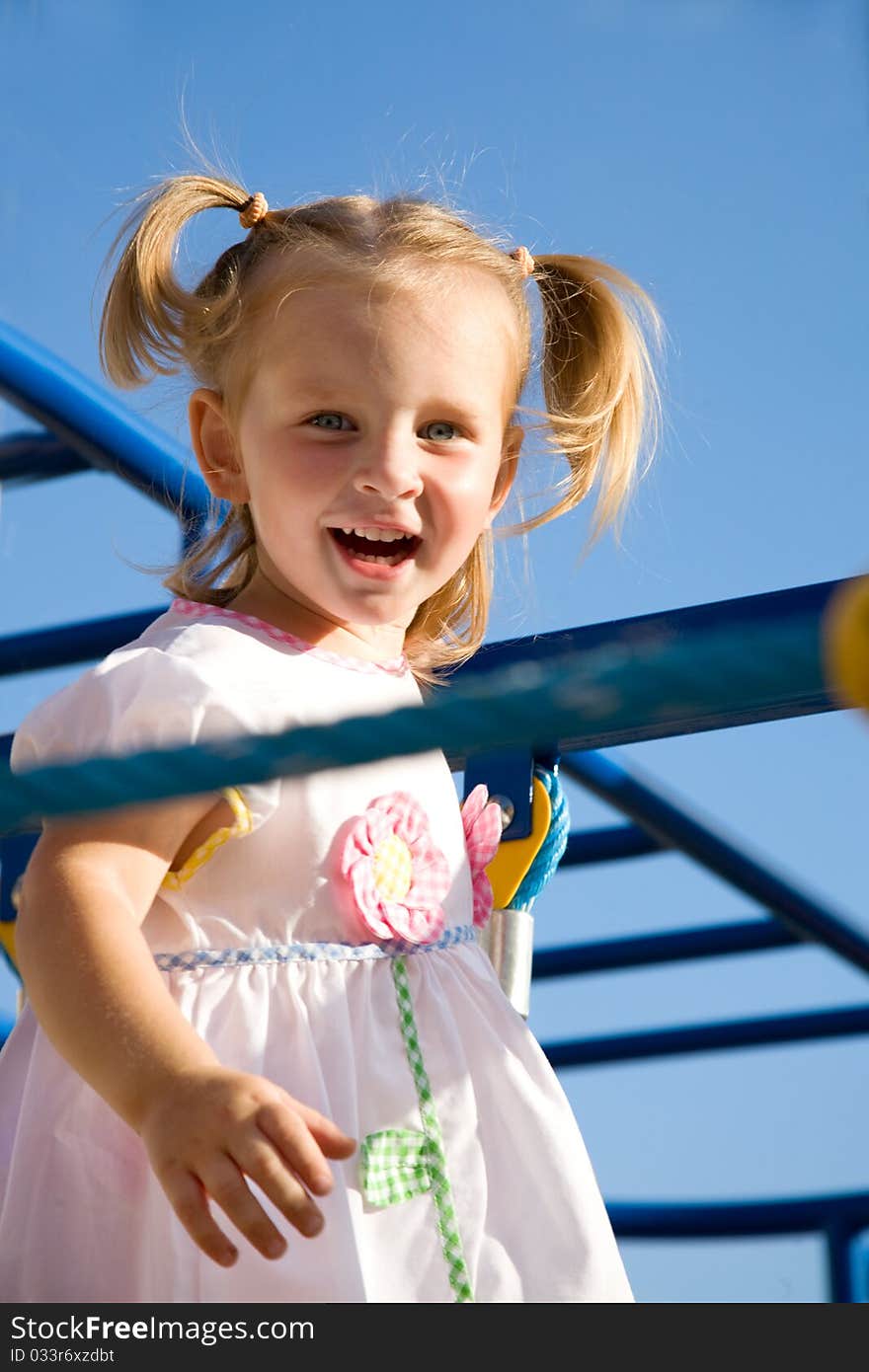 Happy little girl on playground