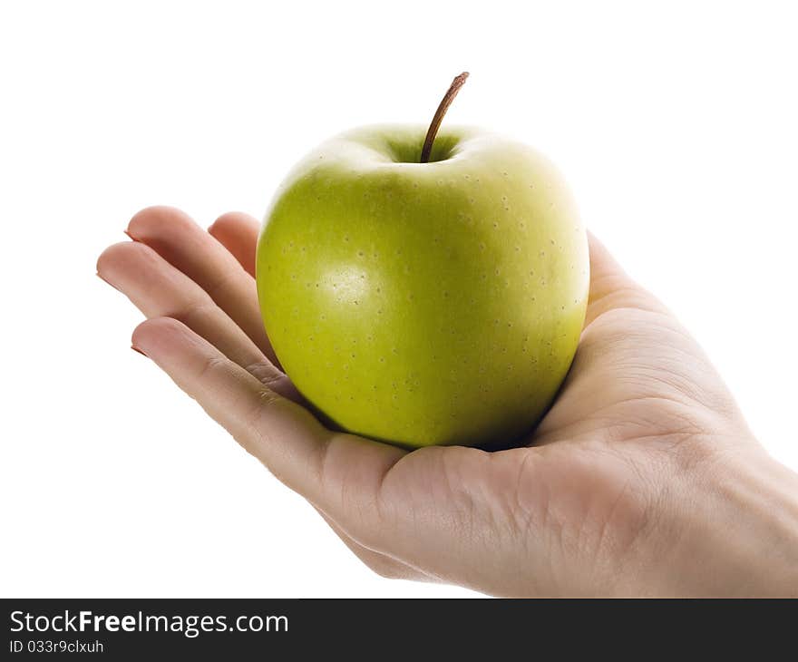 Green apple in a hand