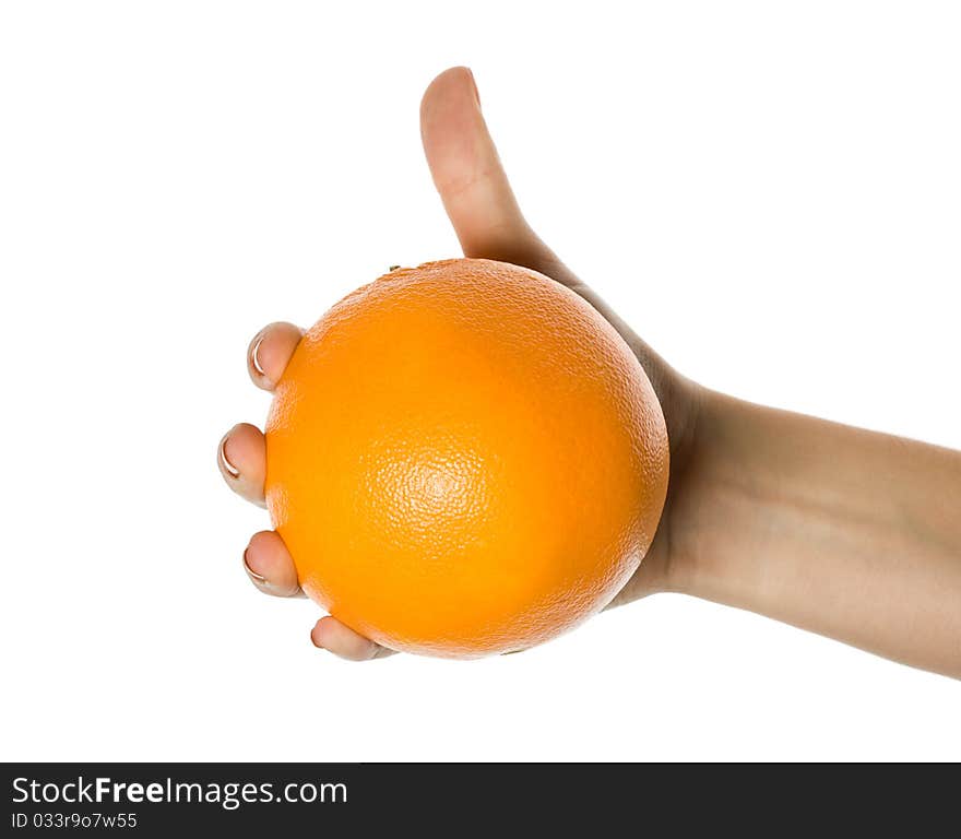 The hand giving an orange, it is isolated on the white. The hand giving an orange, it is isolated on the white