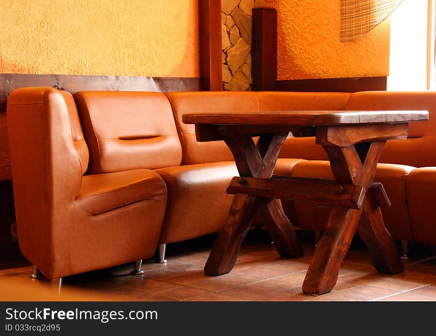 Leather Sofa And Wooden Table