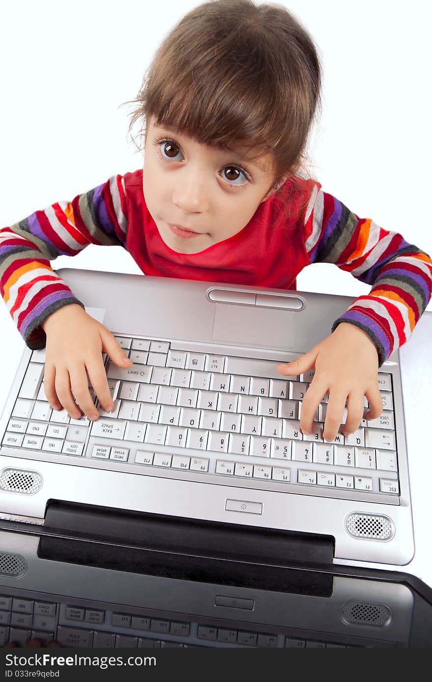 Portrait of a little girl with a laptop