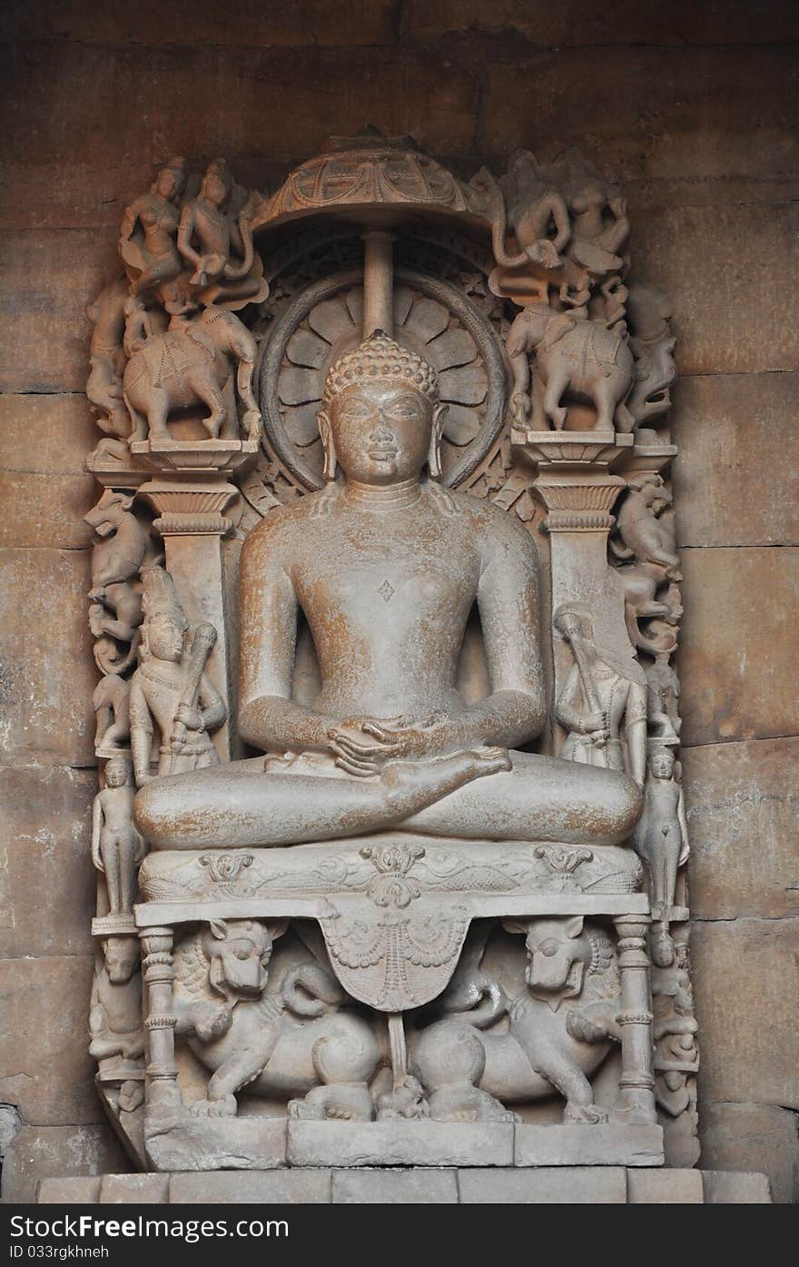 Sitting Buddha in Khajuraho temple in India.