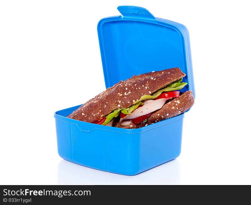 Healthy sandwich in a plastic lunch box isolated on white background