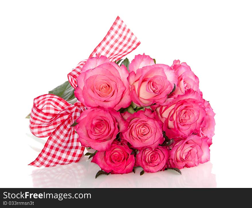 White roses with pink edges with a checkered ribbon isolated over white