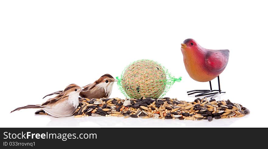 Birdseeds with decorative birds isolated over white