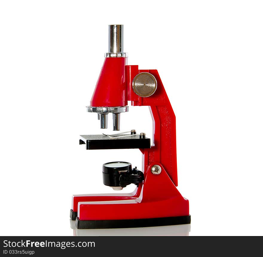 A red microscope isolated over white