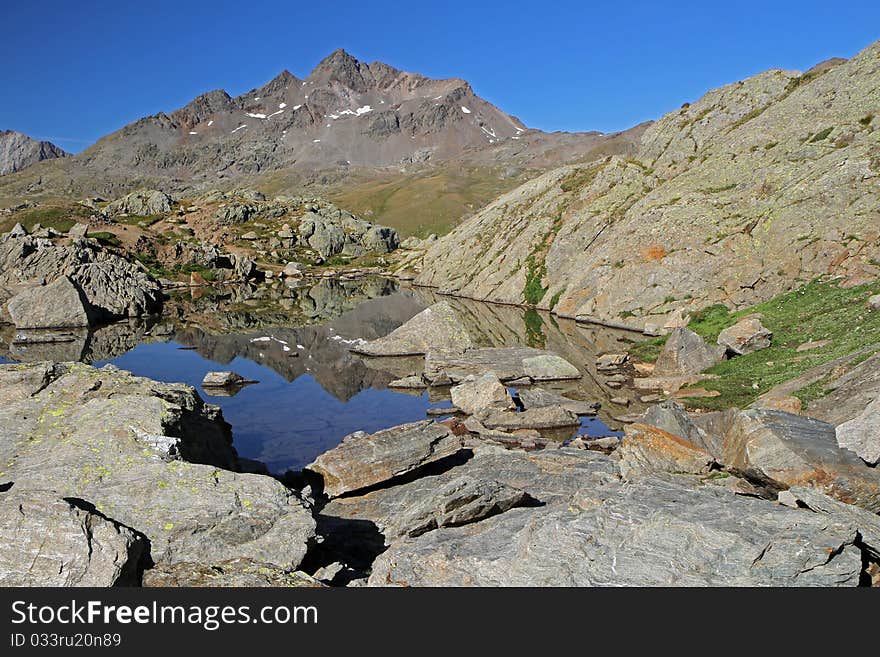 A small alpin lake at 2700 meters on the sea-level near Gavia Pass, Brixia province, Lombardy region, Italy