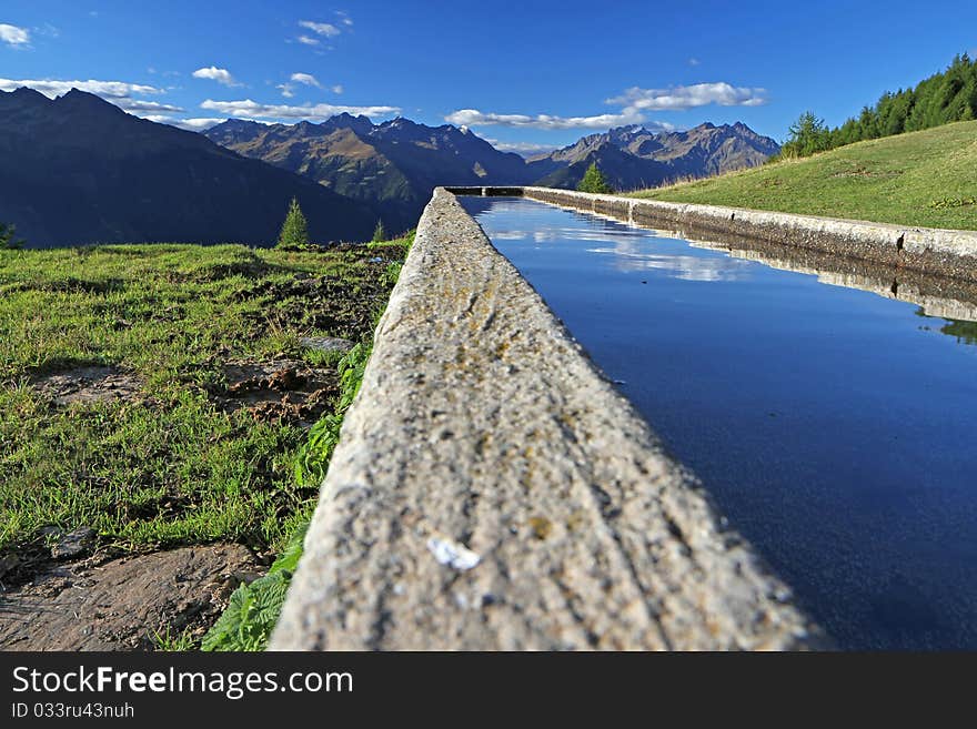 Fountain in the mountains during summer