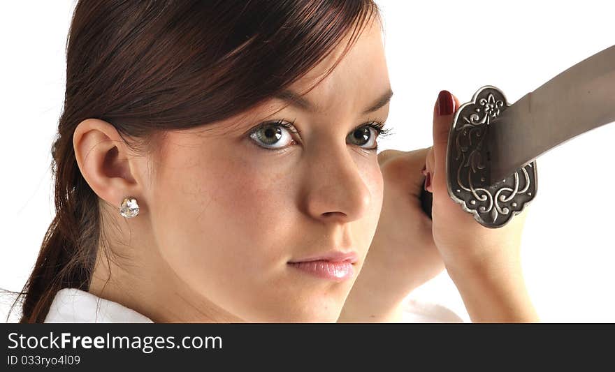 Young woman holding the sword against white background. Young woman holding the sword against white background