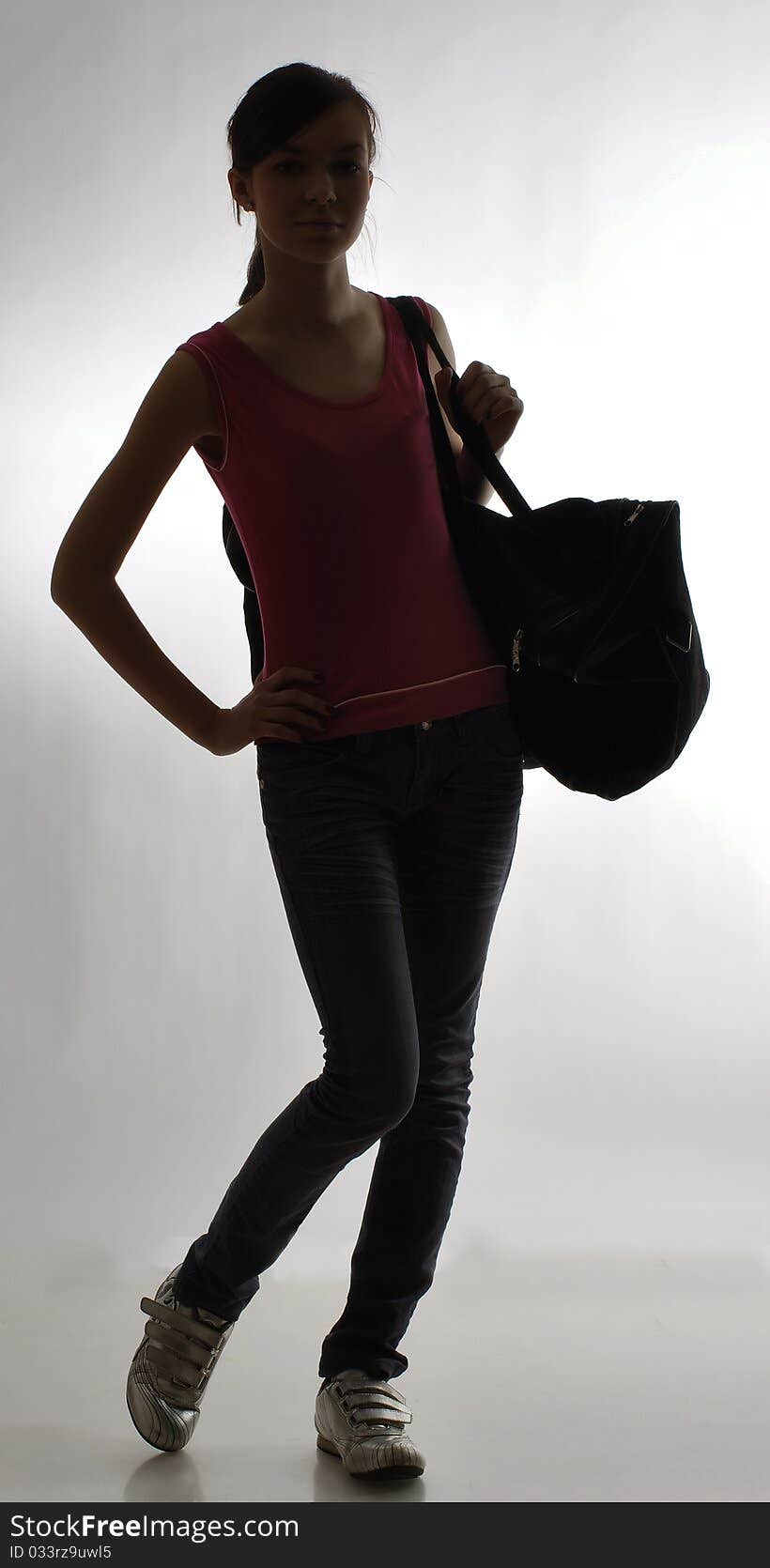 Slim girl with a bag