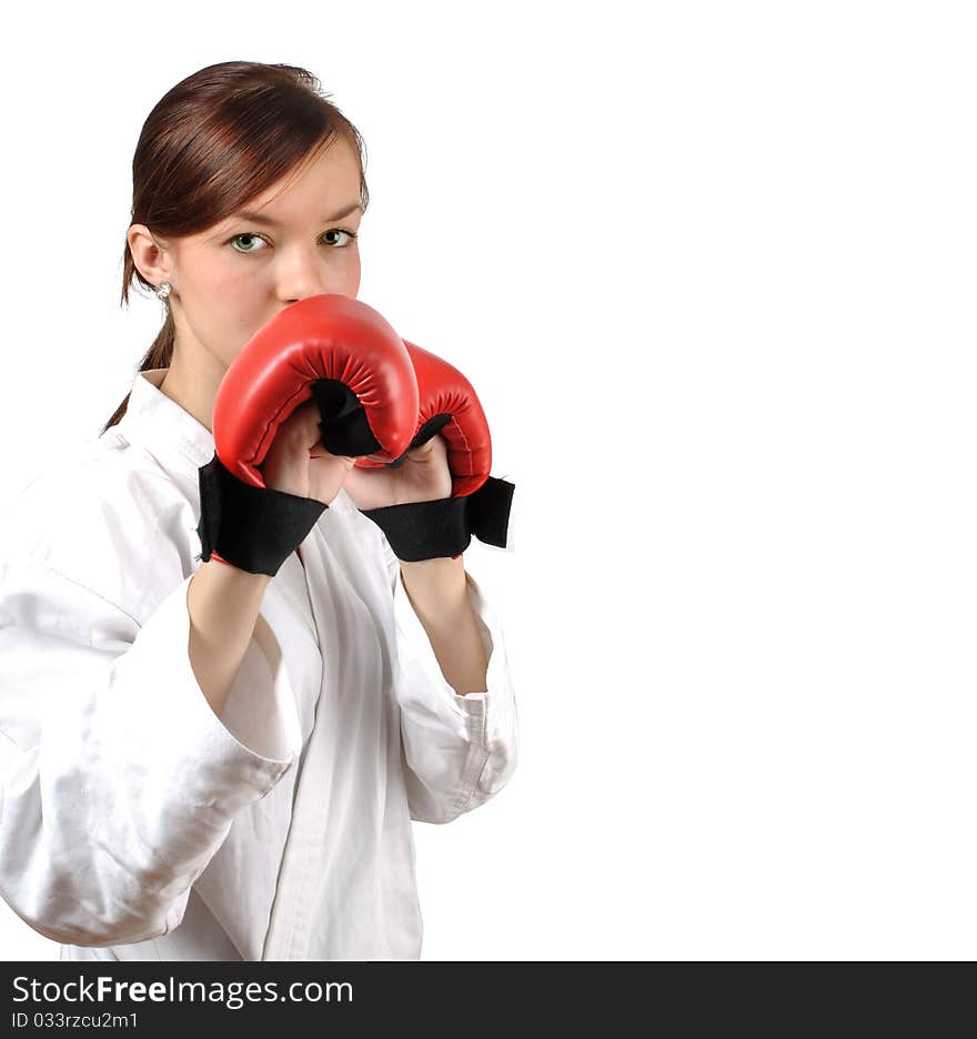 Girl in kimono with red boxing gloves against white background. . Girl in kimono with red boxing gloves against white background.