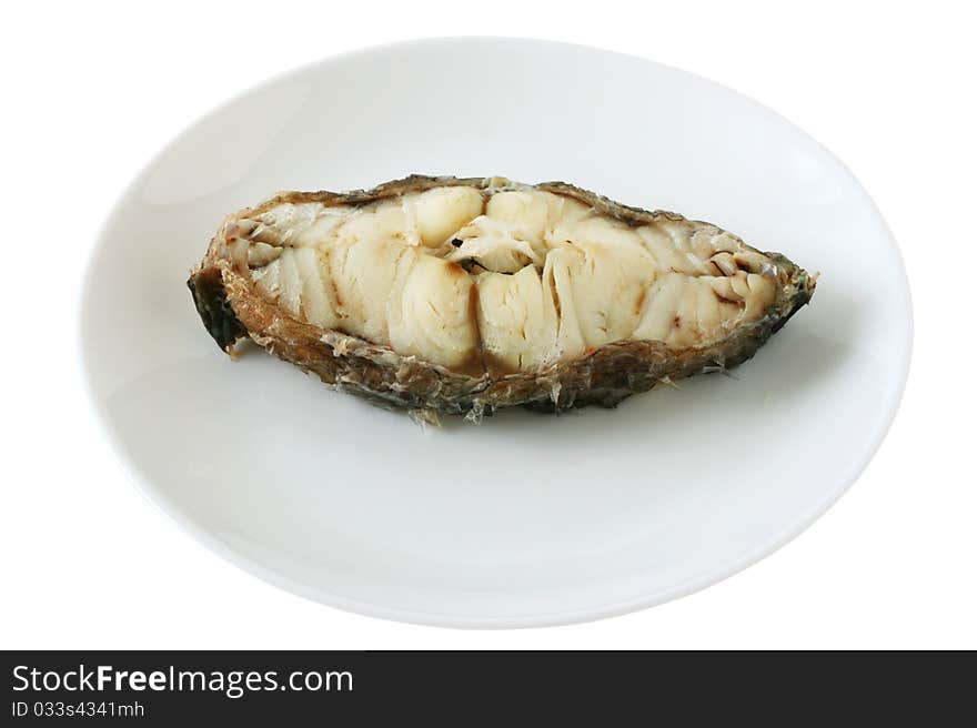 Boiled fish on an white plate. Boiled fish on an white plate