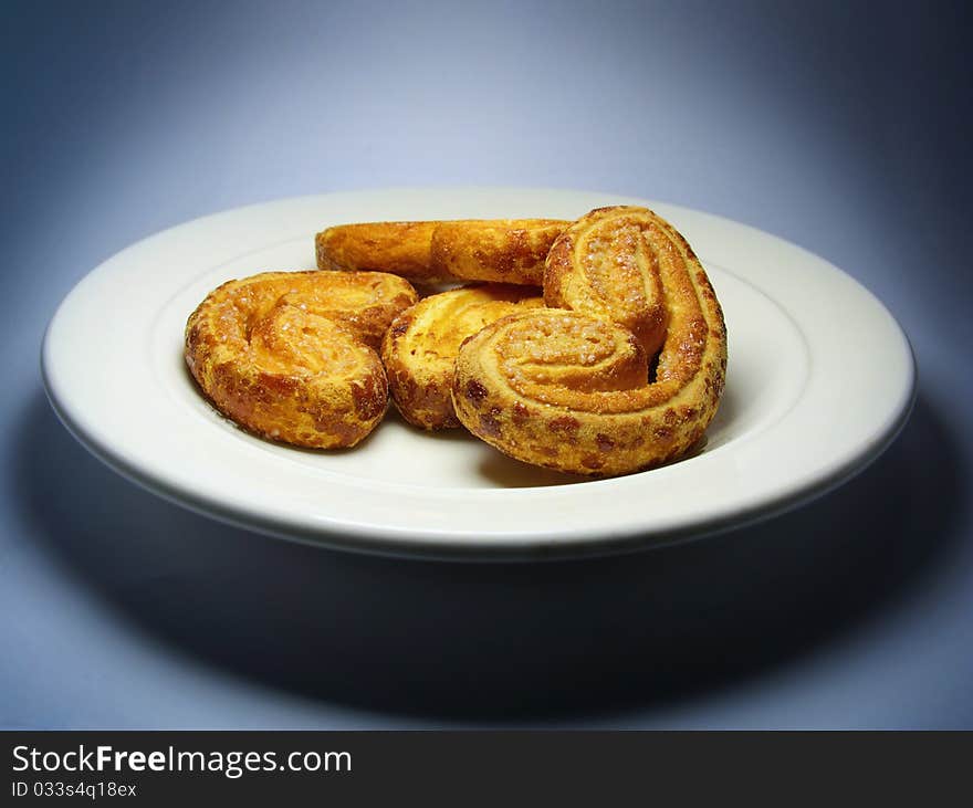 Cookies on plate. Dark blue background