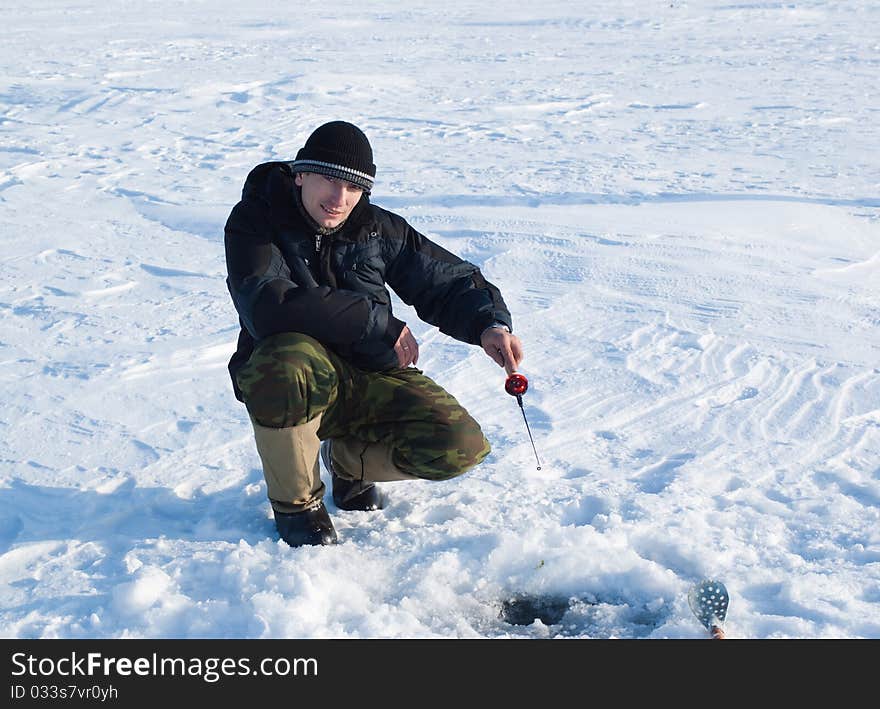 The fisherman on winter fishing