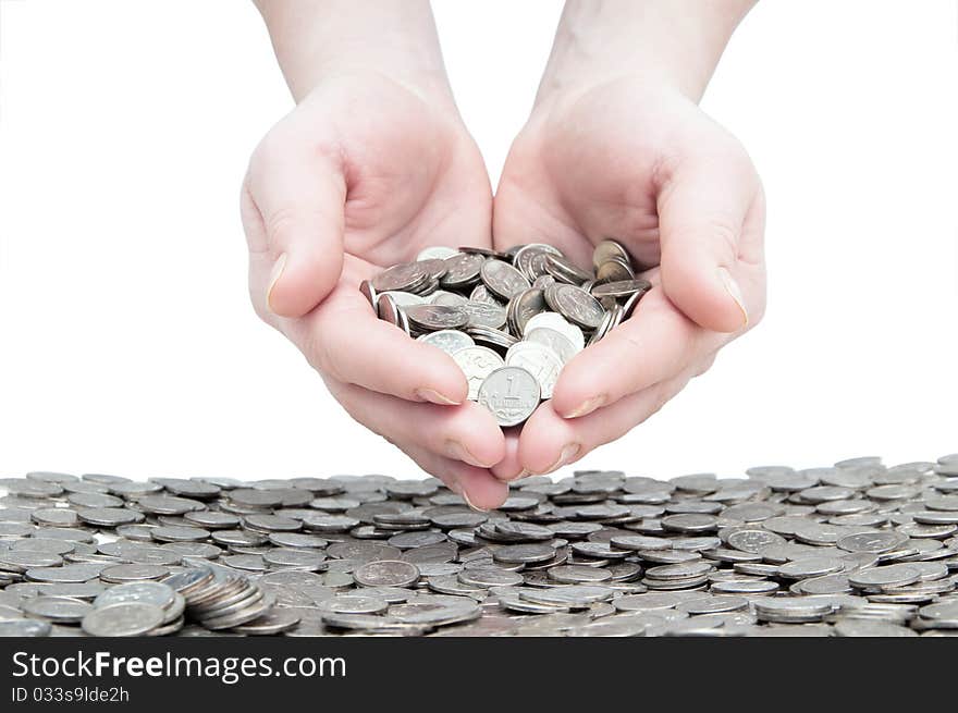 Woman's hands holding a handful of coins. Woman's hands holding a handful of coins