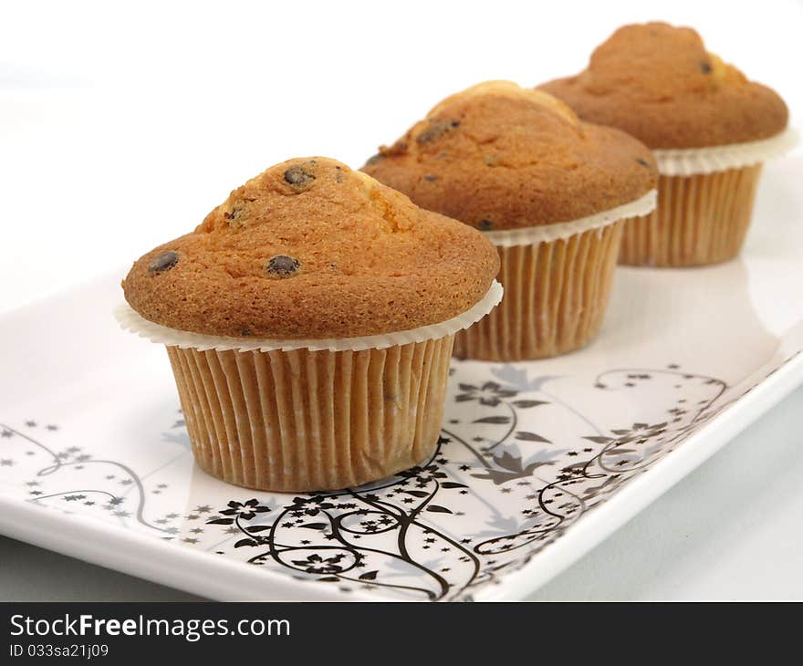 Fresh baked muffins on plate