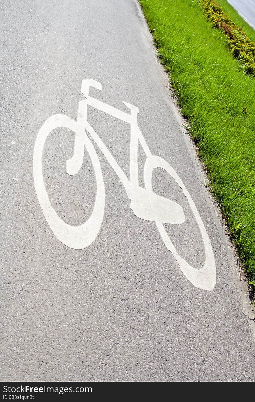 Bicycle sign on bike path in city. Bicycle sign on bike path in city