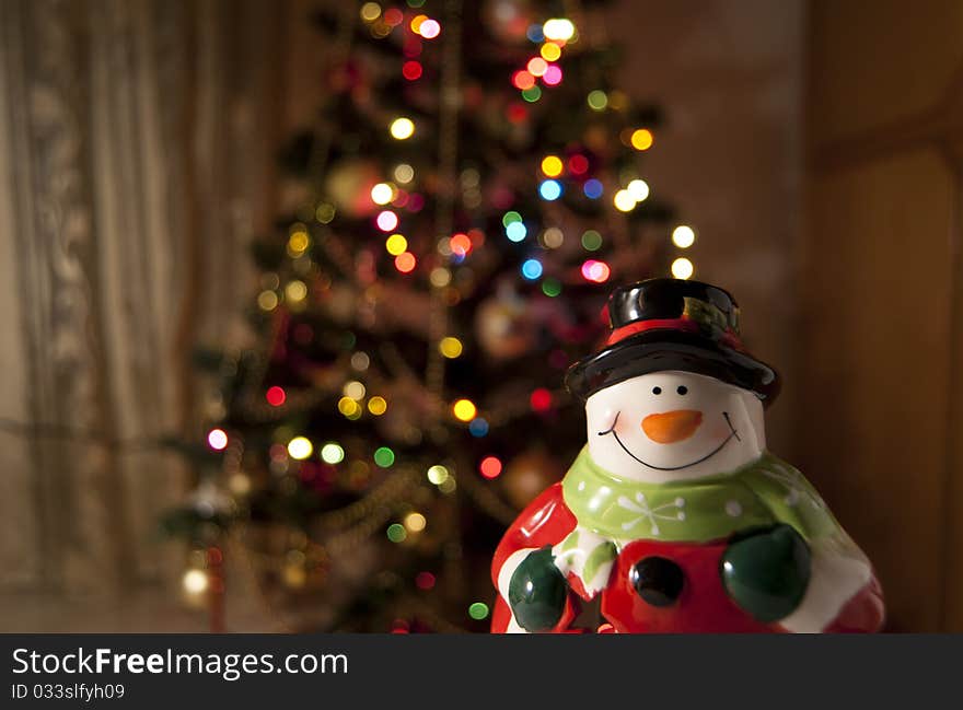 Santa Claus with a blurred Christmas Tree on the background. Santa Claus with a blurred Christmas Tree on the background