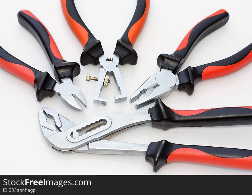 Composition of four different pliers. Composition of four different pliers