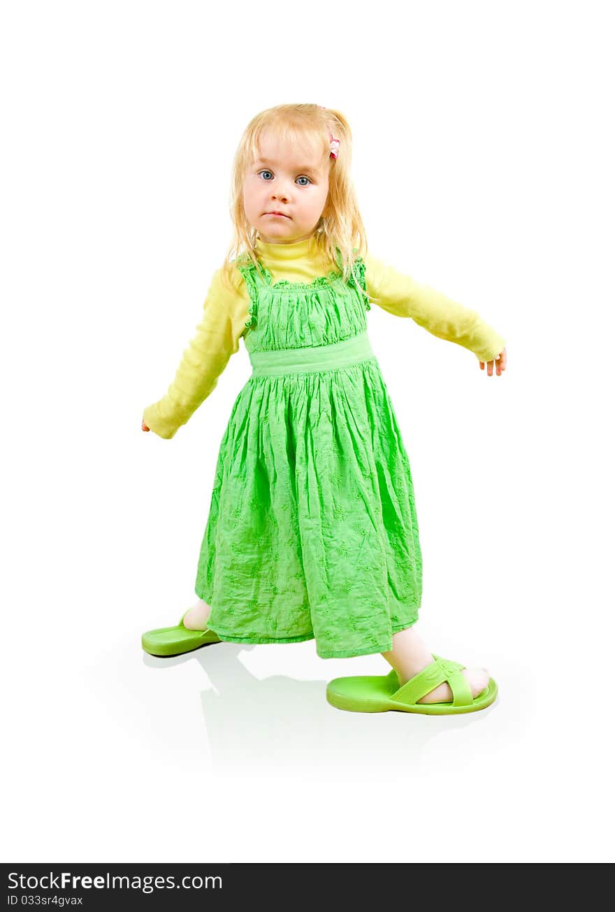 Beautiful little girl with big slippers isolated on white