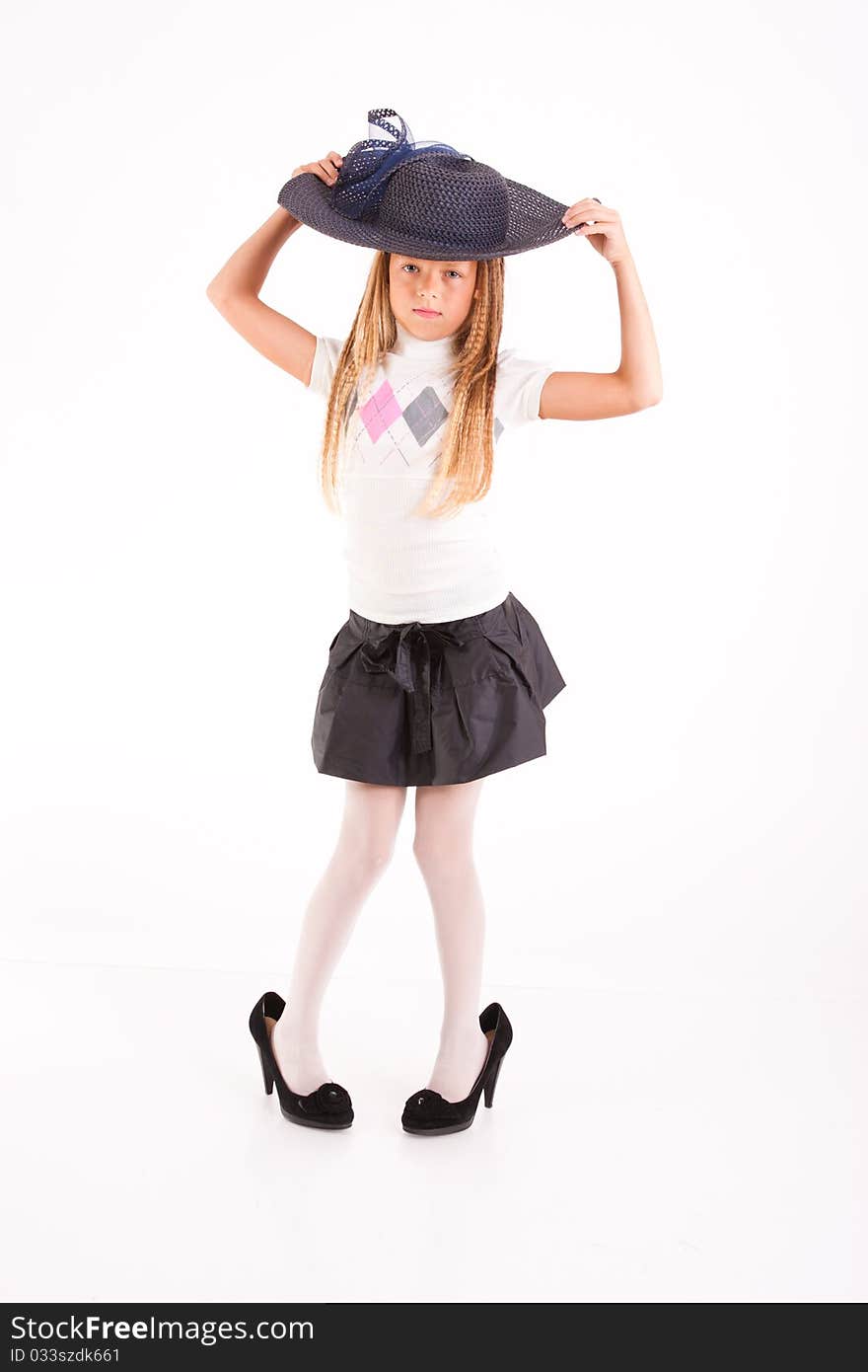 Funny girl in big hat and mum's shoes, isolated on white. Funny girl in big hat and mum's shoes, isolated on white