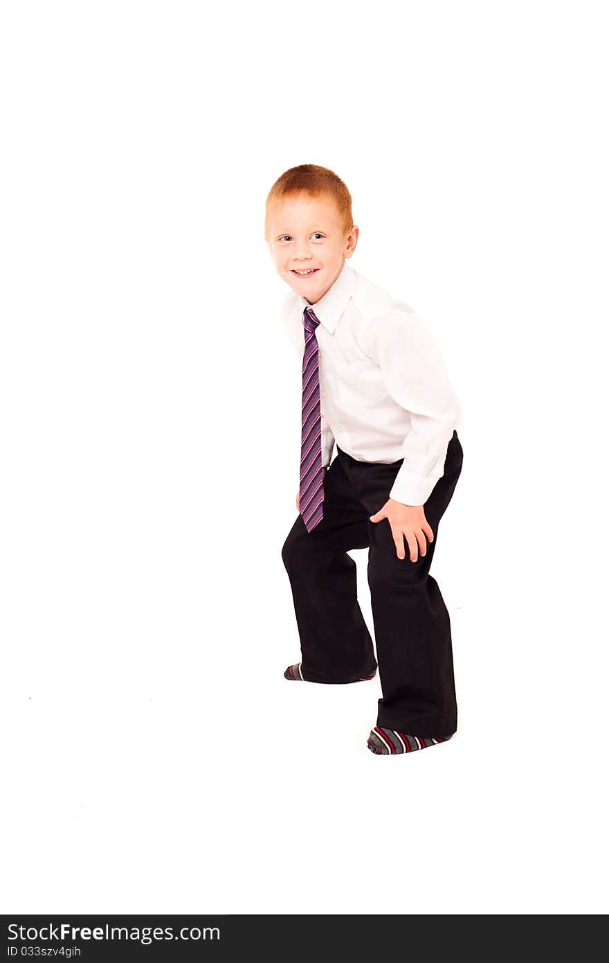 Merry boy in suit on a white background