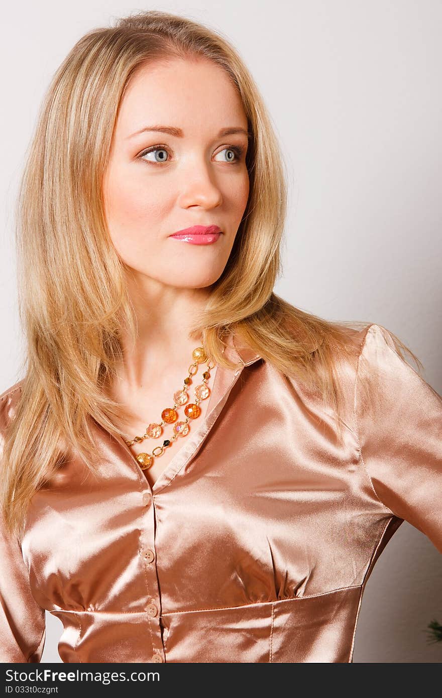 Portrait of young beautiful woman on light background