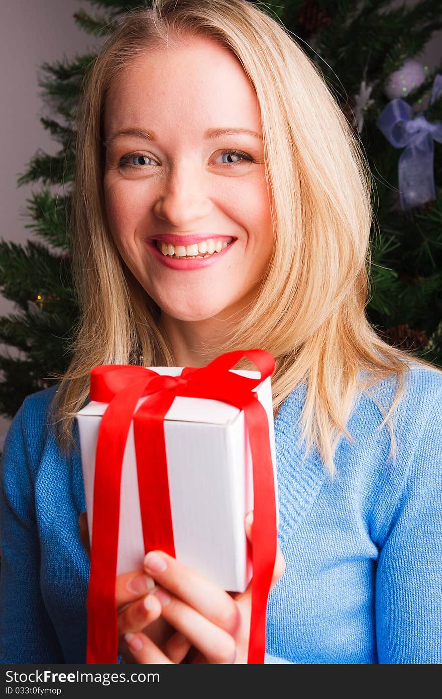 Beautiful  woman  with a Christmas gift