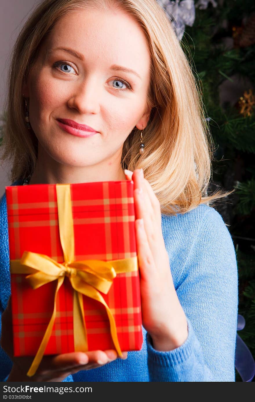 Beautiful  woman  with a Christmas gift