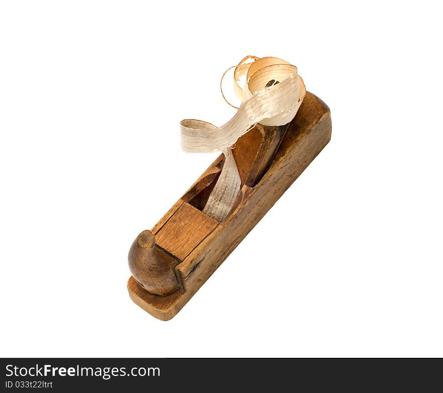 Old wooden plane with a chip on a white background top view. Old wooden plane with a chip on a white background top view.