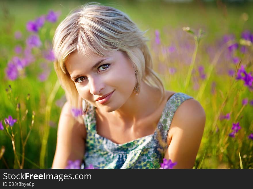 Girl Smiles On Meadow