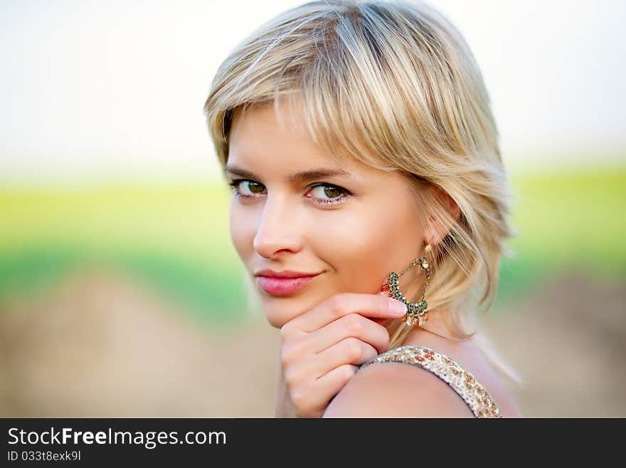 Girl Smiles And Keeps Catkin