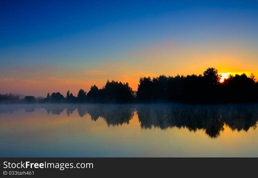 Dramatic sunrise on big lake