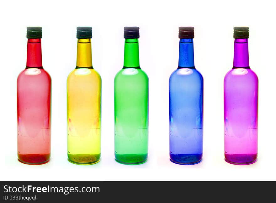 Bottles with diffrent colors on white background