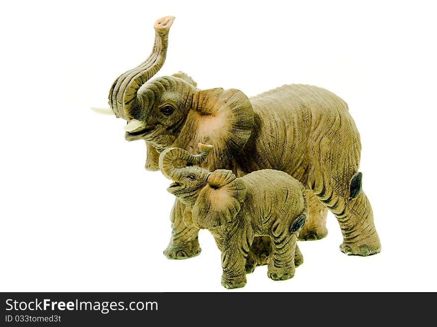 Figurine of the big and small elephant on a white background. Figurine of the big and small elephant on a white background