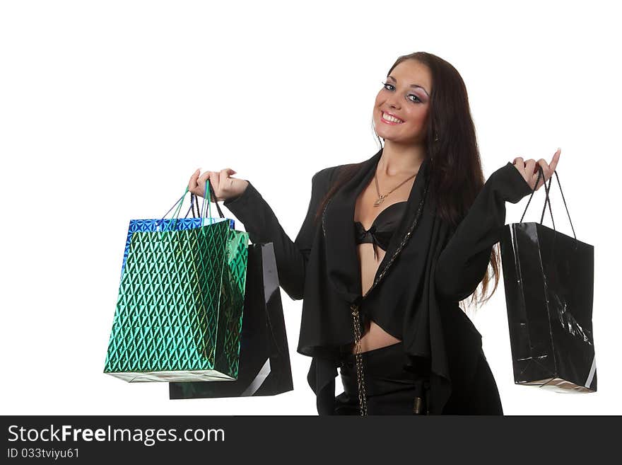 Young smiling woman with a shop bags. Young smiling woman with a shop bags