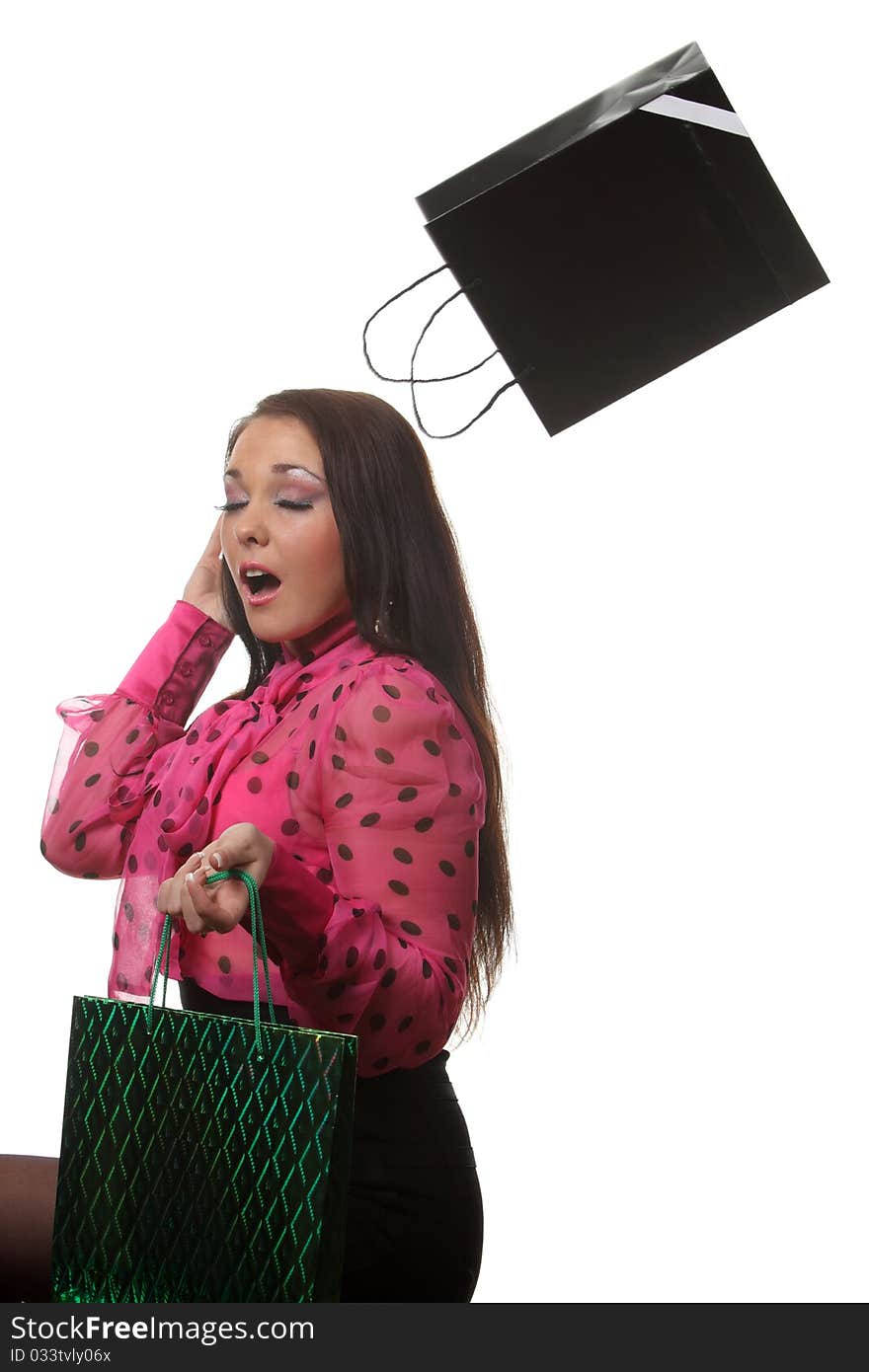 Young smiling woman with a shop bags. Young smiling woman with a shop bags