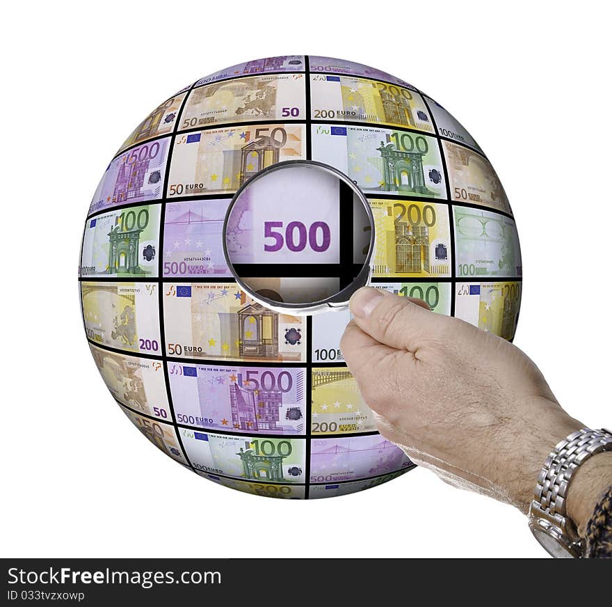 This picture shows a hand with a magnifying glass on a sphere of banknotes. This picture shows a hand with a magnifying glass on a sphere of banknotes