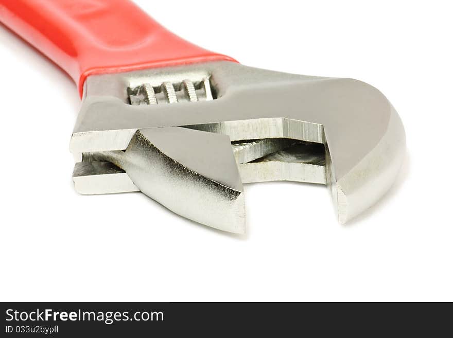 Steel wrench with red plastic handle isolated on white. Steel wrench with red plastic handle isolated on white