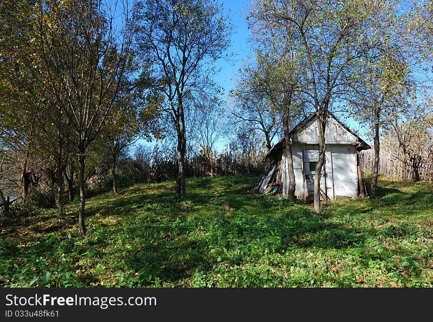 A house in ruin in an autumn landscape. A house in ruin in an autumn landscape