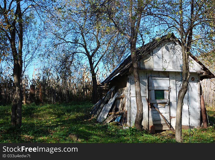 A house in ruin in an autumn landscape. A house in ruin in an autumn landscape